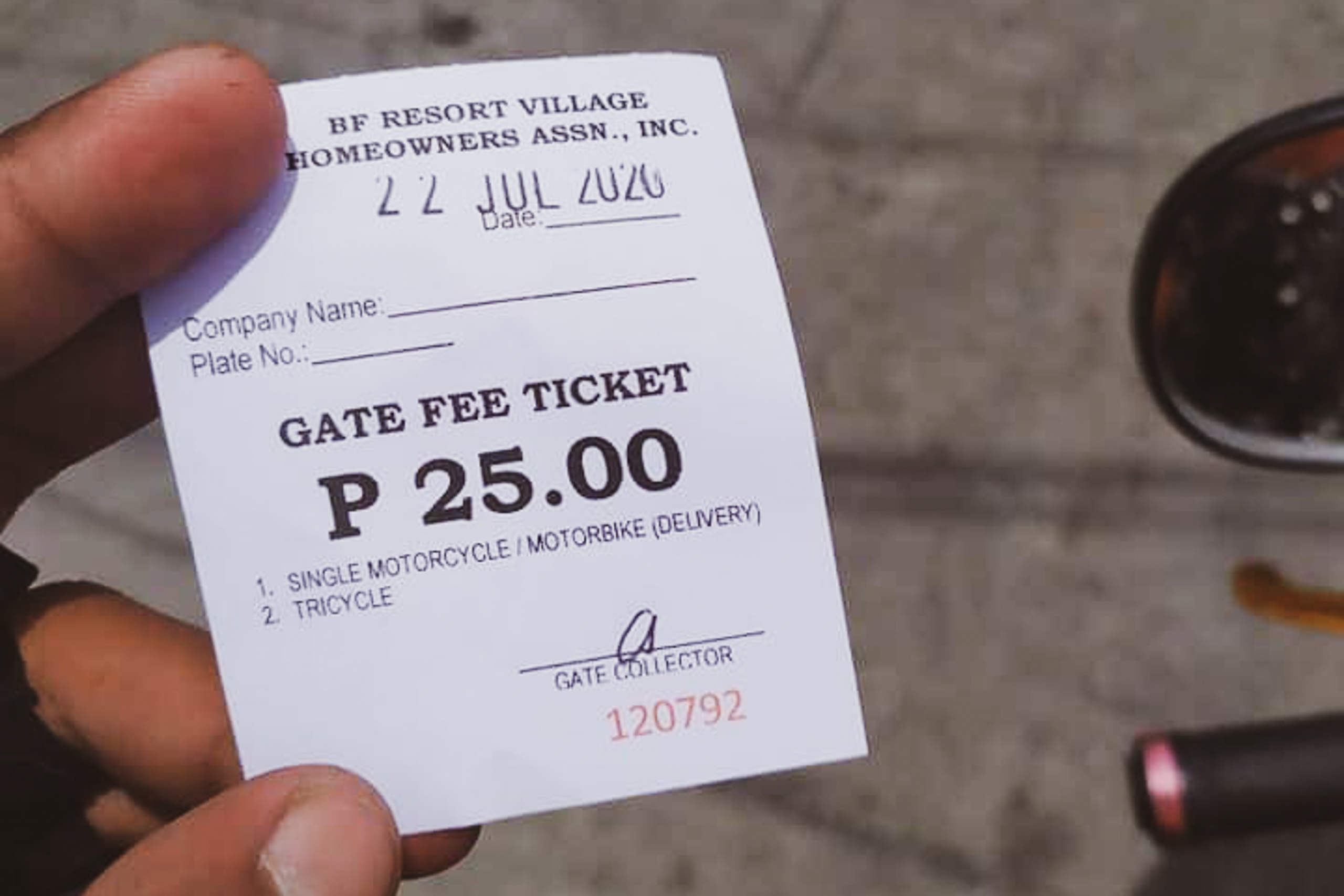 A Las Piñas subdivision is charging delivery riders an entry fee